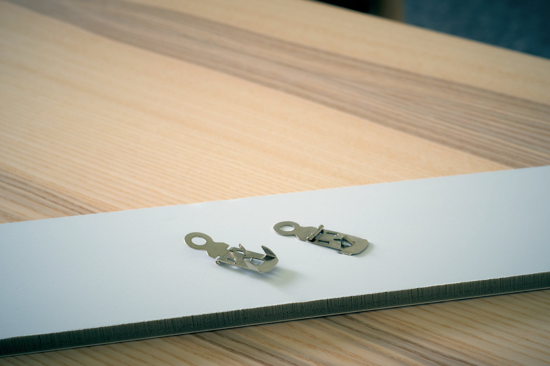 Ukázka háčků pro fotoobraz na desce od studia Pikitia